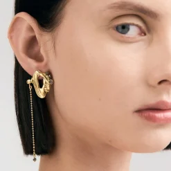 Asymetryczne, pozłacane kolczyki z meteorytem z kolekcji Meteoros