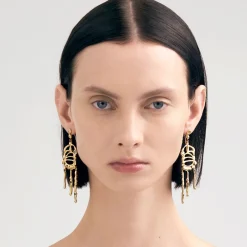 Długie, pozłacane kolczyki na biglu z meteorytem z kolekcji Meteoros