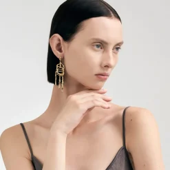 Długie, pozłacane kolczyki na biglu z meteorytem z kolekcji Meteoros