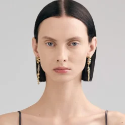 Długie, pozłacane kolczyki z meteorytem z kolekcji Meteoros